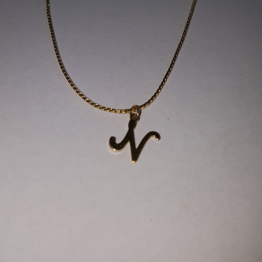 Gold necklace with N charm